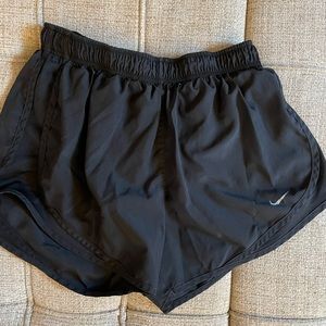 Black Nike dri-fit women’s black running/athletic shorts - size: medium